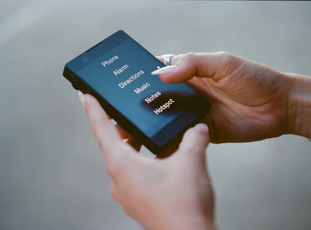 Light Phone III, Mudita Kompakt, and Punkt MP02 minimalist phones side by side for a 2026 comparison